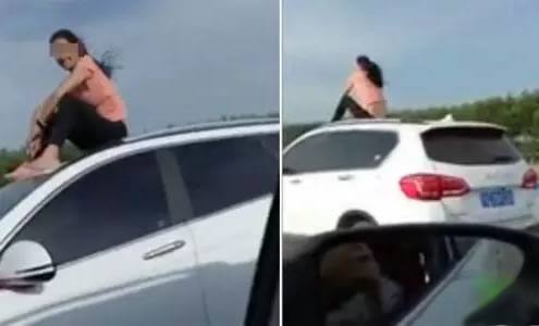 坐在车顶的这名女子